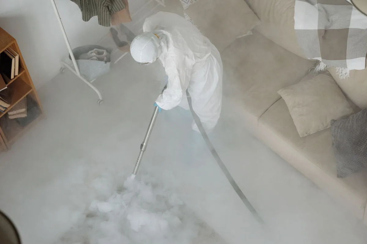 Biohazard cleanup technician in protective equipment, Greeley, CO